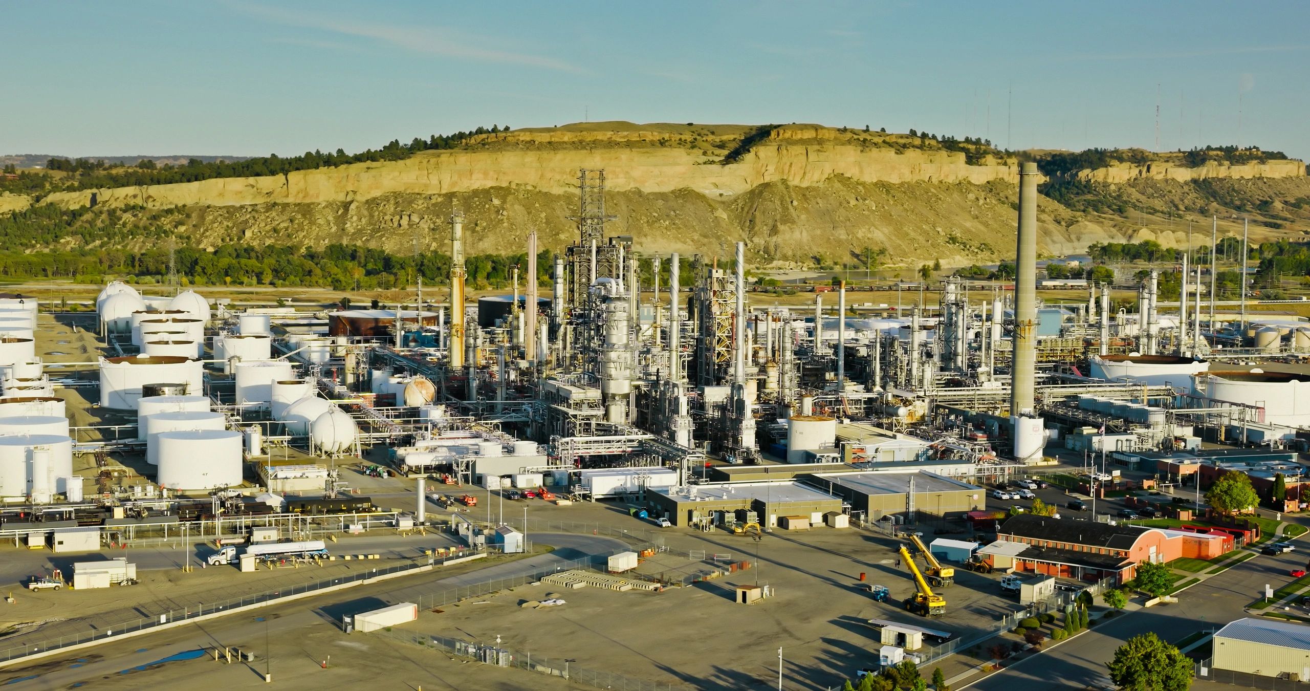 Aerial view of an oil refinery, representing refined product supply
