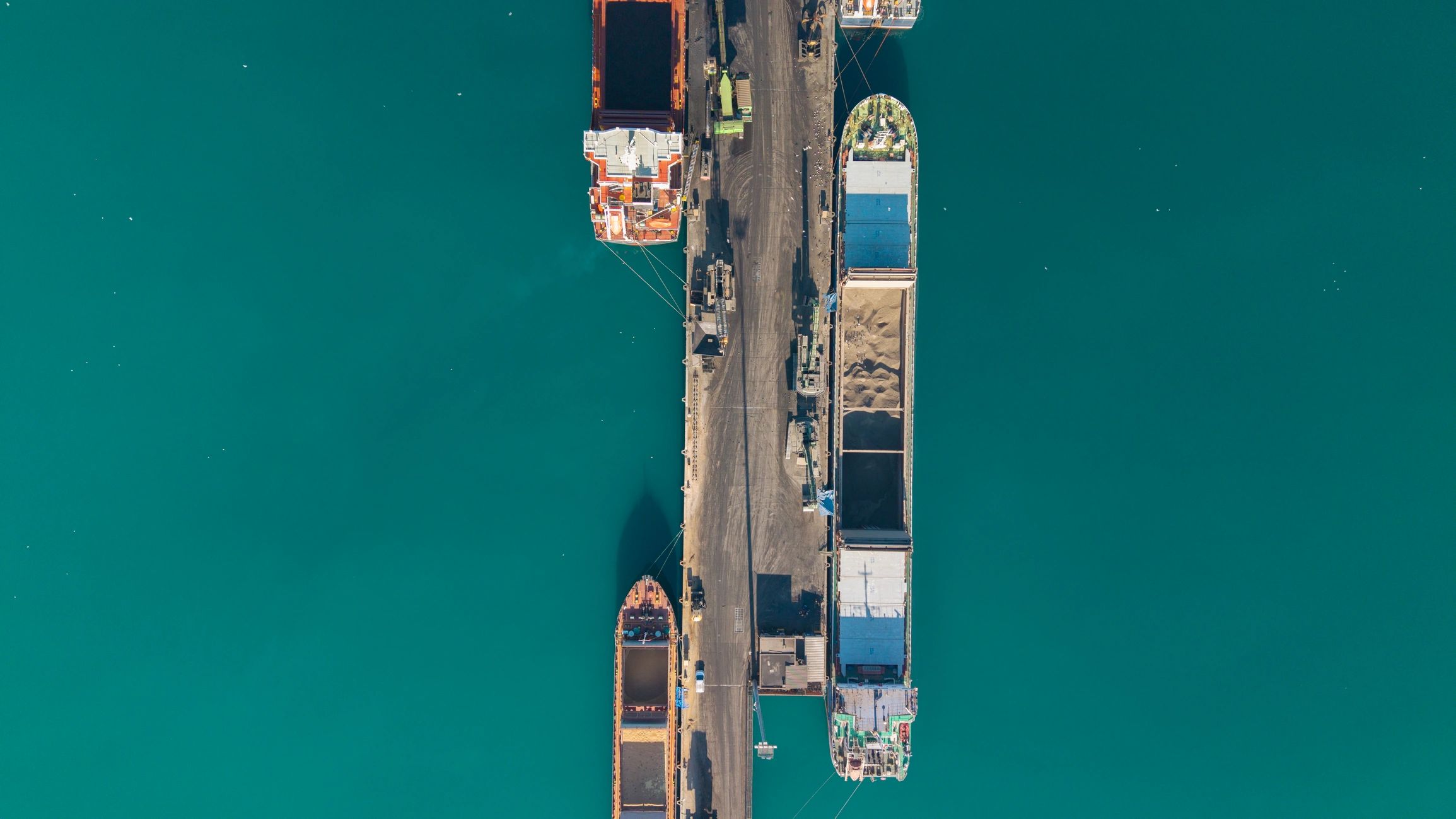 Aerial view of cargo ships docked at a port